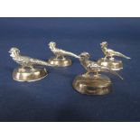 Set of four Sampson Morden & Co silver place setting/menu holders in the form of standing golden