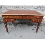 A Victorian mahogany kneehole writing desk, the rectangular top with moulded outline and rounded