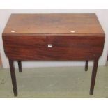 An early 19th century mahogany Pembroke table with frieze drawer raised on four square tapered legs