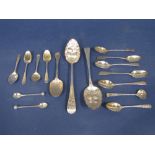 Pair of George III berry serving spoons, with typical embossed bowls and engraved handles, maker