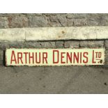 A vintage enamel sign of rectangular form - Arthur Dennis Ltd, with red lettering on a cream
