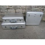 Three Halliburton aluminium cases of varying size and design