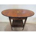 A small Edwardian rosewood drop leaf occasional table, the top of oval form when extended, over a