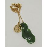 9ct fine link necklace hung with a carved nephrite pendant and a further 14k pendant of circular