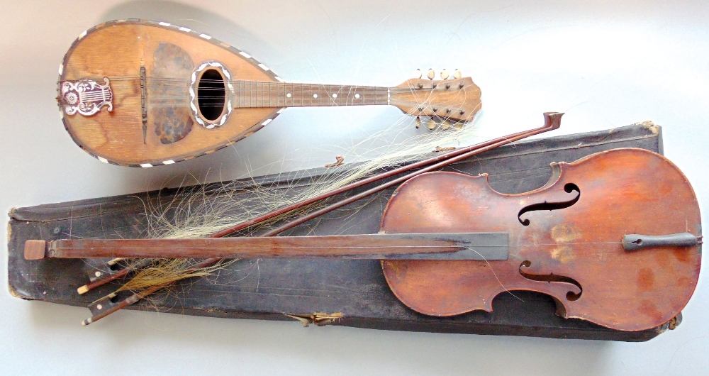 An unusual cased single stringed long neck violin with paper label to interior Italian renascent F H