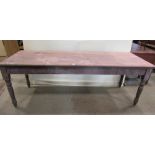 A 19th century stained pine kitchen table, the three plank top of rectangular form raised on