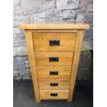 A contemporary light oak five drawer pedestal chest, 56cm wide x 103cm high