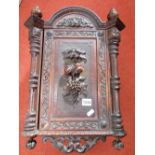 A small good quality, late 19th century German or Austrian wall cupboard, the front elevation with