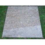 A coloured and speckled polish granite slab/kitchen work surface with rounded corners (4ft square)
