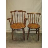 A set of eight (6&2) Swedish stained beechwood stick back dining chairs with circular seats raised