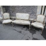 A three piece salon suite comprising two seat sofa and a pair of matching armchairs with