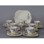 A Fenton Art Deco tea service with floral detail comprising milk jug, sugar bowl, cake plate, six