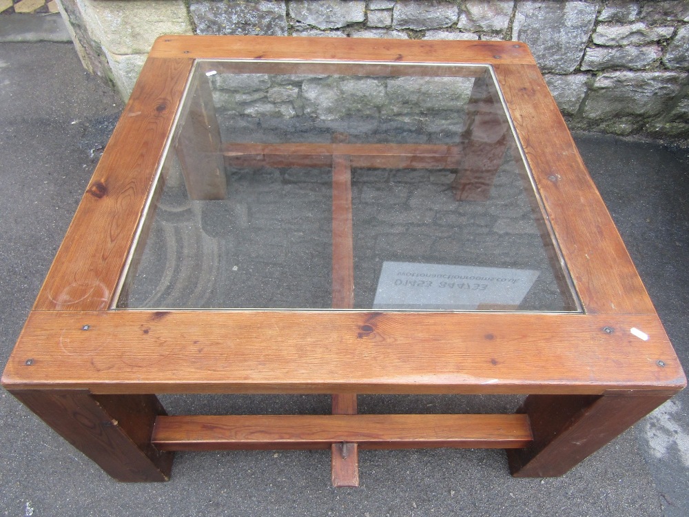 A sturdy pine framed occasional table of square form with inset glass panel raised on substantial - Image 2 of 2