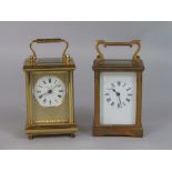 Taylor and Bligh of England gilt brass case carriage clock with engine worked gilt mask and