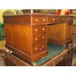 A Georgian mahogany partners writing desk, each side fitted with an arrangement of six drawers and a