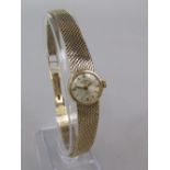 Ladies 9ct Rotary cocktail watch, the champagne dial with baton markers, 9ct mesh strap, 21 grams