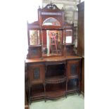 A late Victorian walnut mirrored back side cabinet of narrow proportions, the lower section