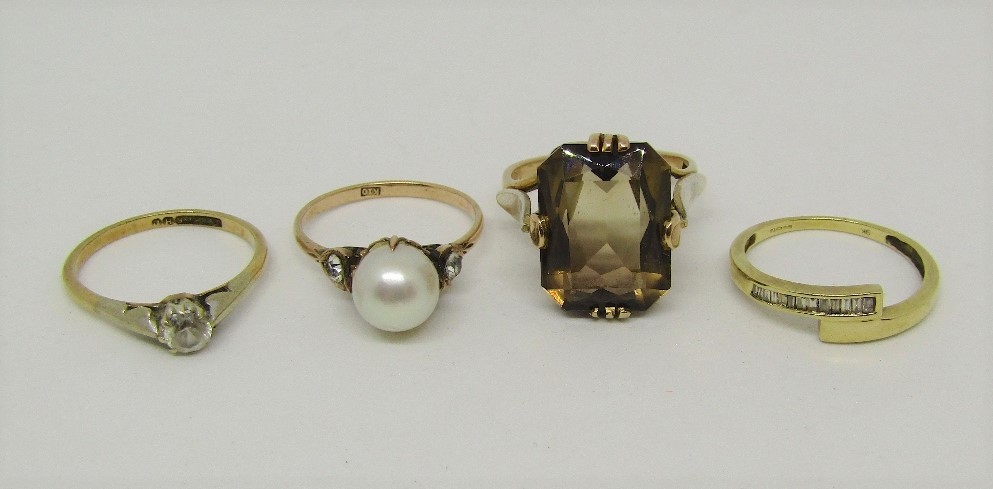 Four gold dress rings comprising a pearl set example stamped 'K10', together with three 9ct examples