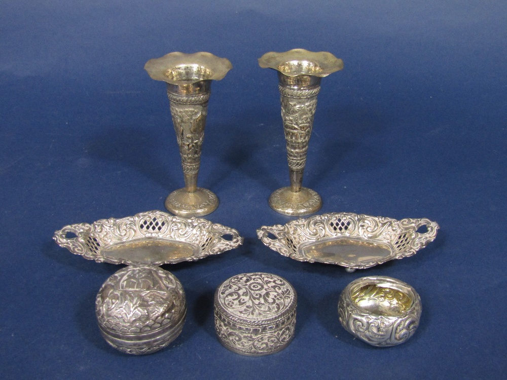 A pair of Victorian silver trinket dishes with pierced diaper sides upon ball feet, with a group