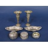 A pair of Victorian silver trinket dishes with pierced diaper sides upon ball feet, with a group