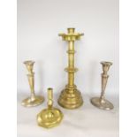 Ecclesiastical brass candlestick with turreted sconce and turned column, 47cm high; together with