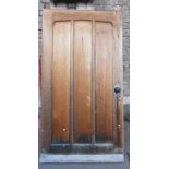 A good quality oak front door with Gothic style panelling, 100 cm high x 90 cm wide