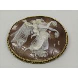 19th century oval cameo brooch depicting Aurora / Eos the goddess of Dawn accompanied by the