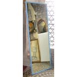 A 19th century ex shop fitting, full length wall mirror of rectangular form with simple moulded