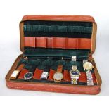 A leather watch carry case containing a collection of vintage wristwatches to include an art deco