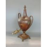 Regency baluster copper samovar, with flaming finial, twin handles, square base and club feet, 46 cm