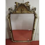 A Georgian carved wood mirror with gilded and painted finish, the carved and pierced surmount with