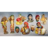 A collection of ten Bossons wall plaster plaques, two full length plaques of gentlemen carriers,