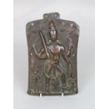 Interesting embossed eastern bronze panel with a standing Buddhistic deity flanked by an attendant