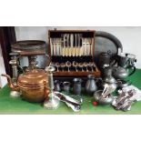 A mixed collection of metal ware to include two canteens of cutlery, an Arts & Crafts brass tazza, a