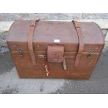 A vintage brown fibre and stitched leather reinforced domed top travelling trunk, with brass lock,