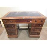 A small Victorian mahogany kneehole twin pedestal writing desk, the rectangular top with faux