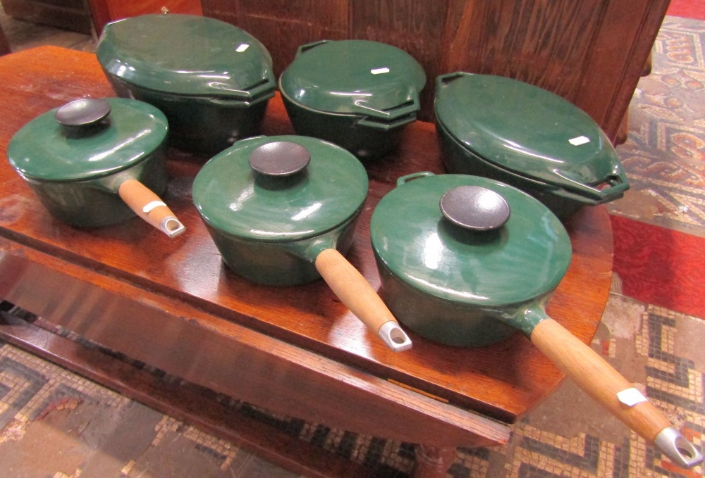 Three good quality, hardly used, Aga cast iron racing green coloured enamelled saucepans with turned