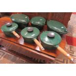 Three good quality, hardly used, Aga cast iron racing green coloured enamelled saucepans with turned
