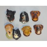 Twenty one Bossons plaster bust plaques of dogs, and various other characters