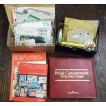 A box containing a quantity of unsorted loose British and worldwide stamps, a box containing first