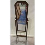 An Edwardian/1920s oak cheval mirror, the moulded frame of canted arched form set within a simple