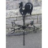 An iron work weather vane, the cut sheet steel finial in the form of a cockerel, 93cm high