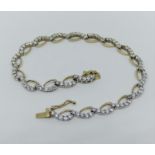 9ct stylised bi-colour bracelet set with white paste, 8.6g (one stone vacant)