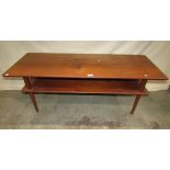 A Danish teak two tier occasional table of rectangular form with moulded outline and raised on