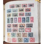 A collection of world stamps in a black album including Belgium, Belgian Congo, France, etc