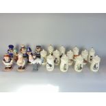 A collection of Leslie Ann Ivories's spice jars, each decorated with different cats, together with a