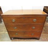 A Georgian mahogany secretaire chest, the front elevation presented as three drawers, the fall front