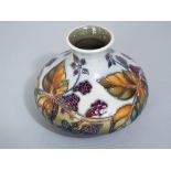 A Moorcroft grey ground vase with blackberry and bramble decoration and impressed marks to base,