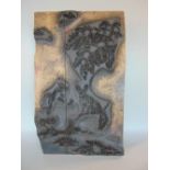 A vintage wooden printing block with raised image/relief detail of a squirrel on a branch amongst