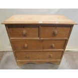 A small Victorian stripped pine bedroom chest of two short over two long drawers with shaped